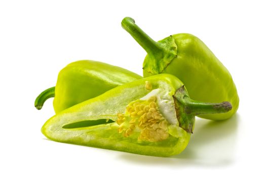 green sweet peppers on a white background