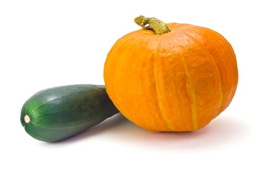 one ripe pumpkin and zucchini isolated on a white background