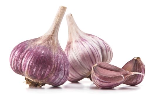 heads of garlic and garlic cloves on a white background