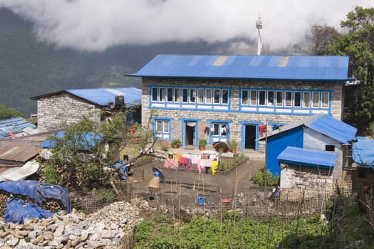 Colorful house in the mountain village of Lukla (2840 Metres) in the Nepalese Himalaya - the gateway to Mount Everest. Nepal