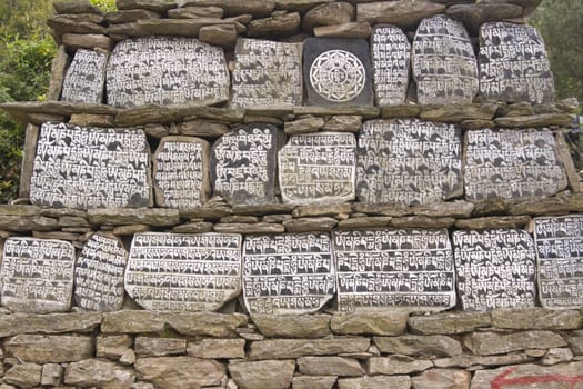 Buddhist Mani stones along the trekking route to Everest Base camp in Nepal