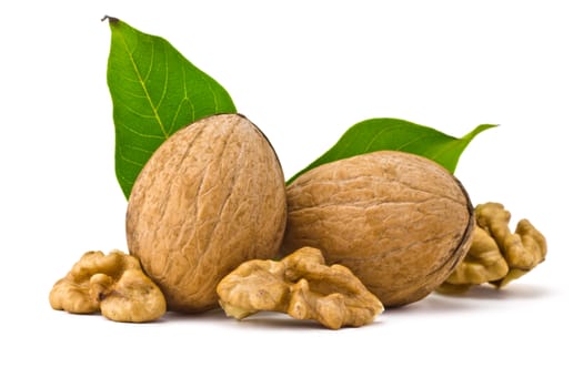 two walnuts, of kernels belonging and leaves on a white background