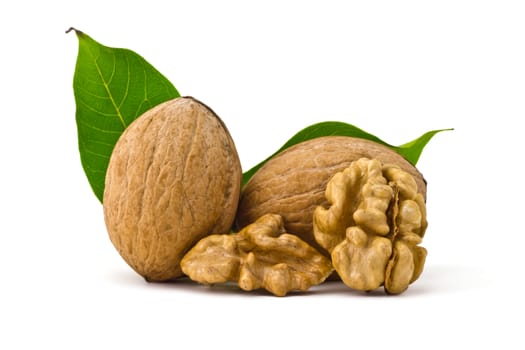 two walnuts, of kernels belonging and leaves on a white background