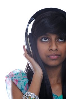 Teenage girl from india listens to music