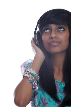 Teen girl from india listens to music