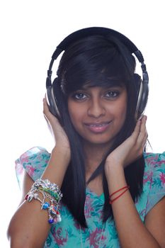Teenage indian girl listens to music