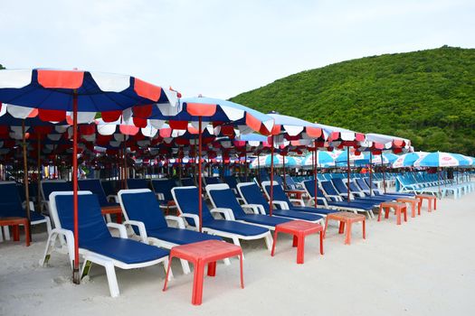beach chairs and umbrella at Koh Larn, Pataya,Thailand