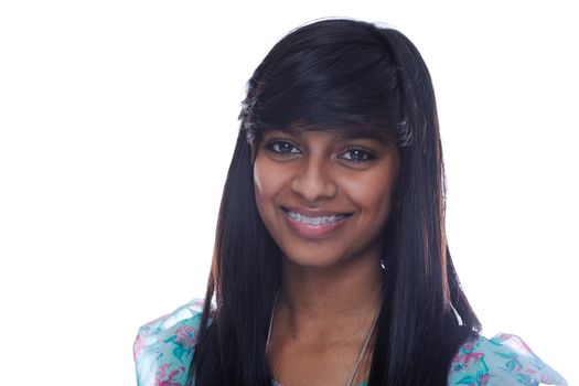 Smiling indian teen girl with brace on teeth