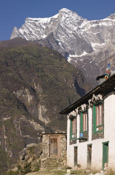 Tibetan style house in the snow capped Himalayan Mountains. Namche Bazar, Nepal.