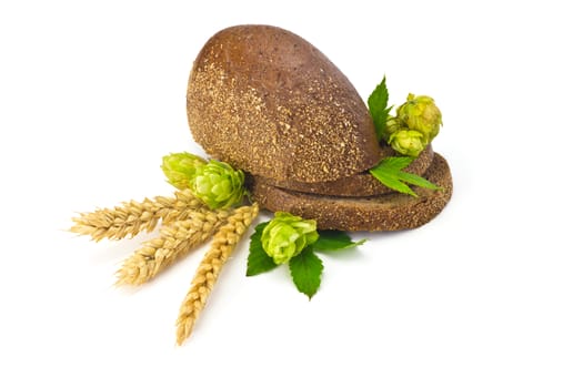 sliced bread, hops cones and spikelets on a white background