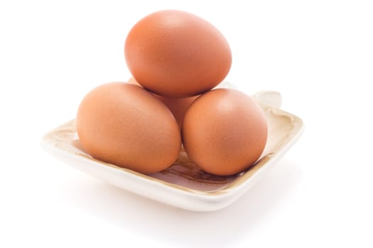 boiled eggs in a plate isolated on white background