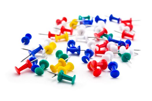 Multicoloured pushpins for record keeping on the white background