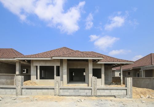 New house under construction with blue sky