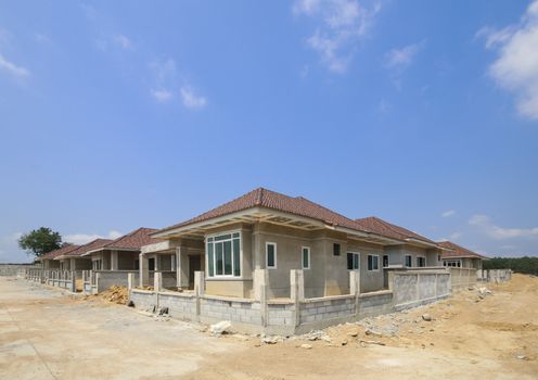 New house under construction with blue sky