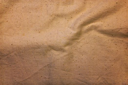 texture of the old, yellowed and crumpled canvas