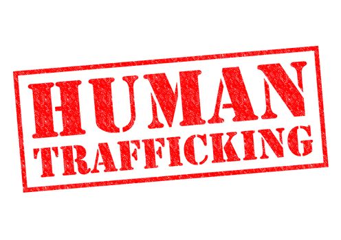 HUMAN TRAFFICKING red Rubber Stamp over a white background.