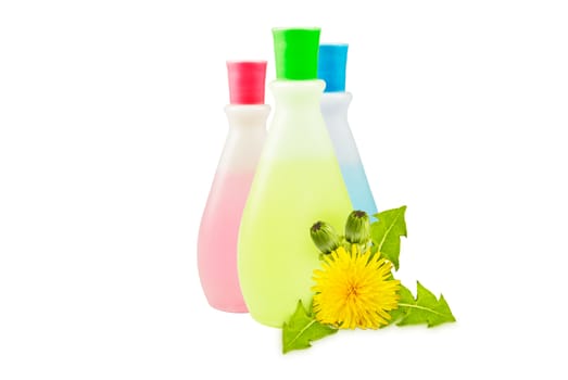 three translucent vial, yellow dandelions with green leaves and buds on a white background