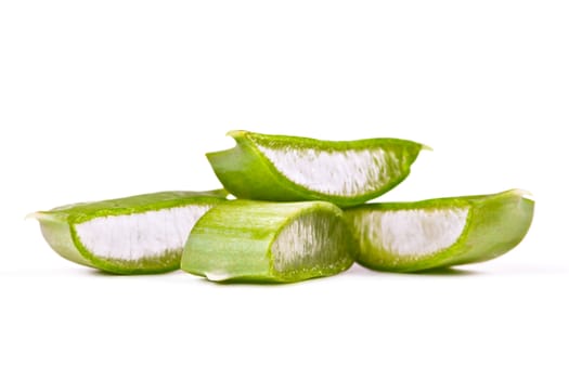 Juicy slices of aloe on white background