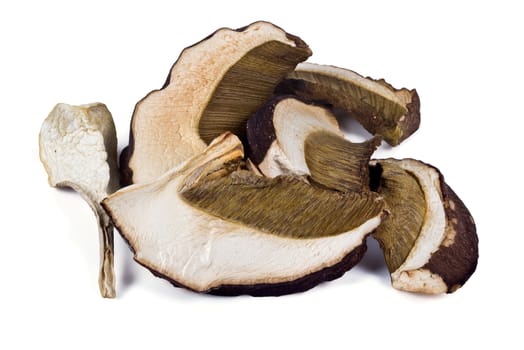 Dried slices of porcini mushrooms on a white background