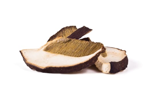 Dried slices of porcini mushrooms on a white background