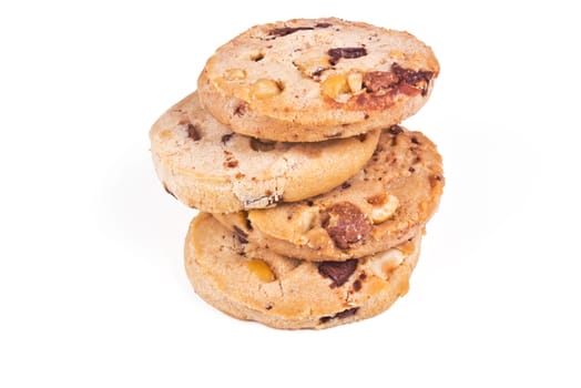 four round shortbread cookies with peanuts and chocolate on white background