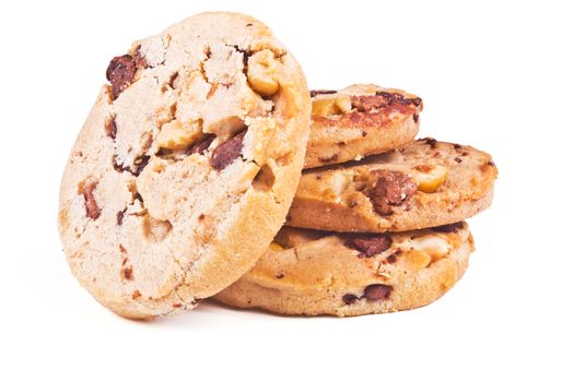 four round shortbread cookies with peanuts and chocolate on white background