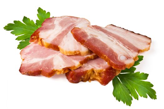 Smoked pork brisket and green leaves of parsley on a white background