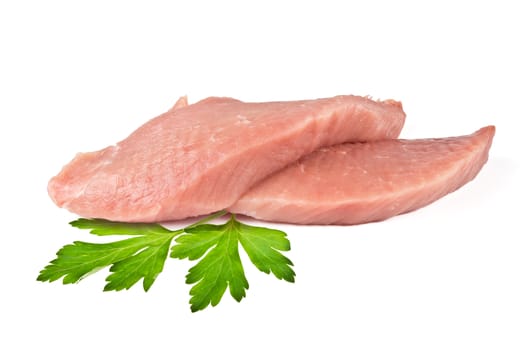 two pieces of fresh meat and parsley leaves on white background