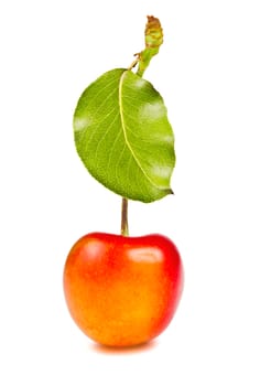 one ripe, juicy, delicious sweet cherry and green leave isolated on white background