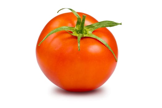 Single fresh, ripe tomato with peduncles isolated on white background