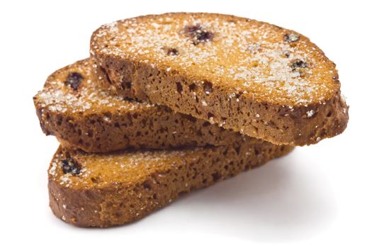 sweet rusks with raisins sprinkled with sugar on a white background