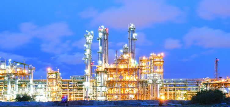 Lighting from structure of oil and chemical factory with blue sky background