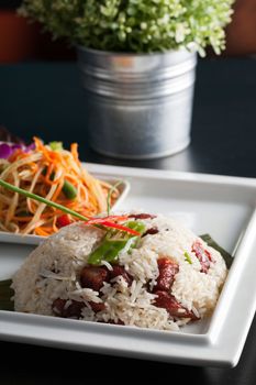 Traditional dish of freshly prepared Thai food.  Thai Sausage and som tum green papaya salad.