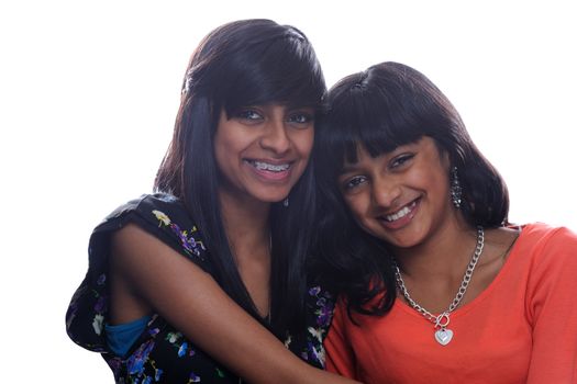 Two young indian sisters isolated