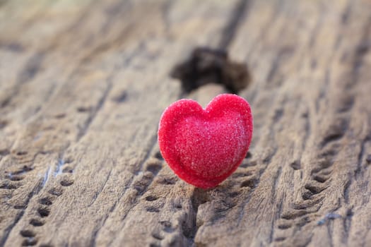 Candy Hearts on wood background