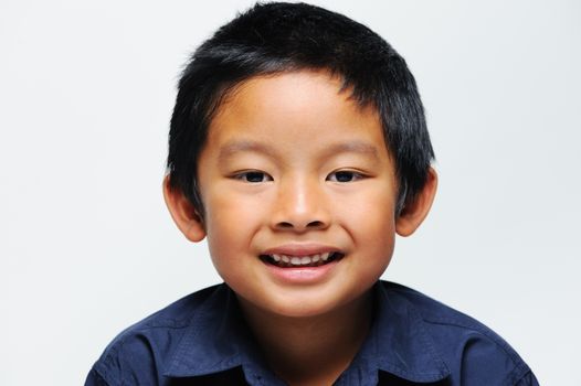 Asian boy smiling close up of face