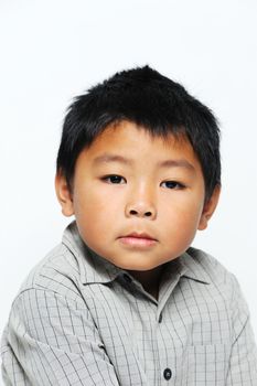 Asian boy looking serious wearing smart shirt