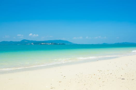 Tropical beach with blue sky background 