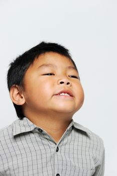 Asian boy looking happy and cute