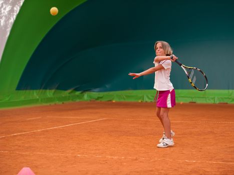 Children at school during a dribble of tennis