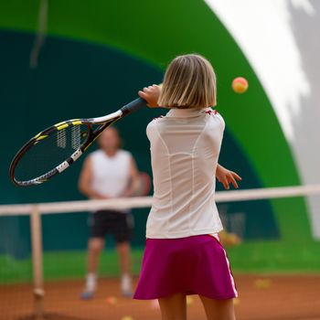 Children at school during a dribble of tennis