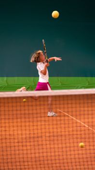 Children at school during a dribble of tennis