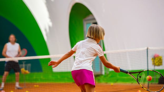 Children at school during a dribble of tennis