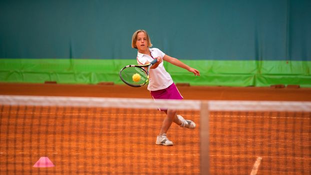 Children at school during a dribble of tennis