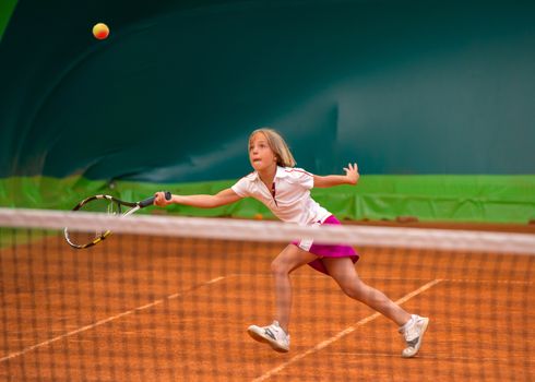 Children at school during a dribble of tennis