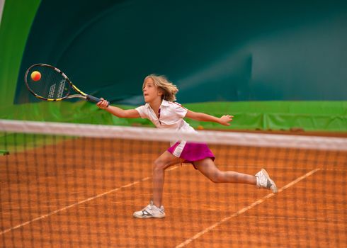 Children at school during a dribble of tennis