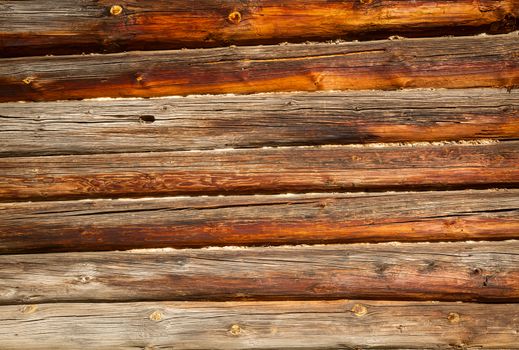 Weathered log house wall background