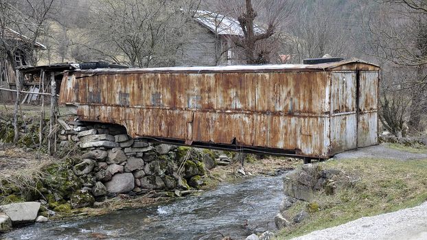 The cabinet from a trailer serving as a footbridge across the river in the Pirin Mountains in Bulgaria 