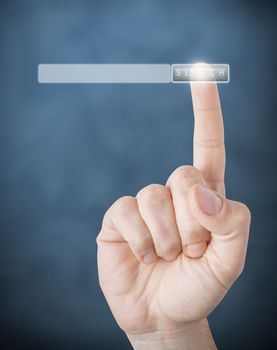 Picture of a finger pointing on a transparent device.

