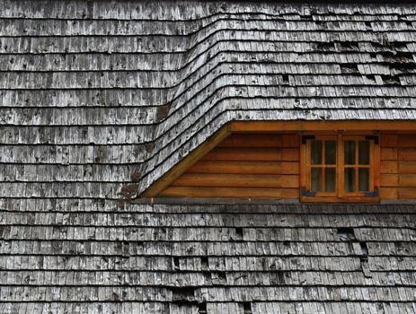 background or texture Old roof on a wooden cottage